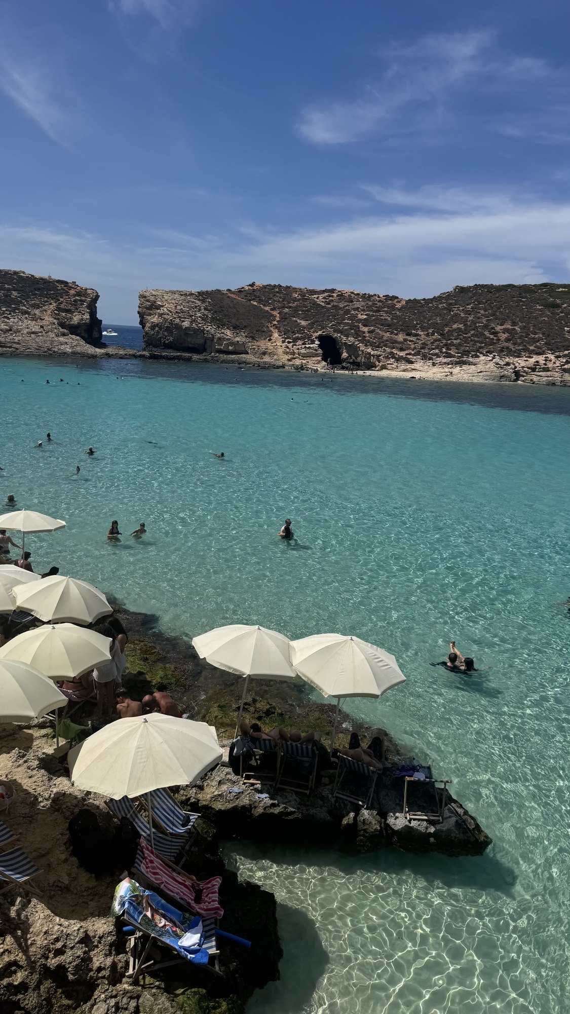 Turquoise lagoon with white umbrellas, Mediterranean coast